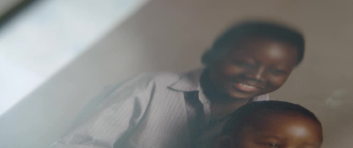 The picture shows two children smiling