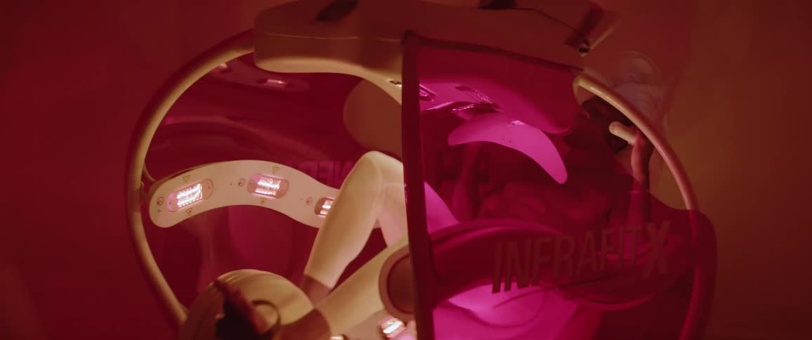 Person pedals a strange looking device with flashing lights