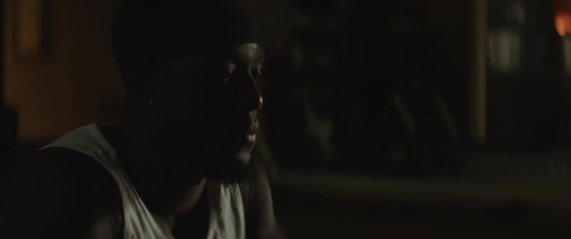 Man presses hands down on the floor with eyes closed