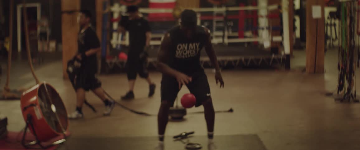 A man is exercising throwing a ball
