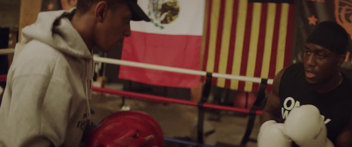 Two men get in the boxing ring to spar