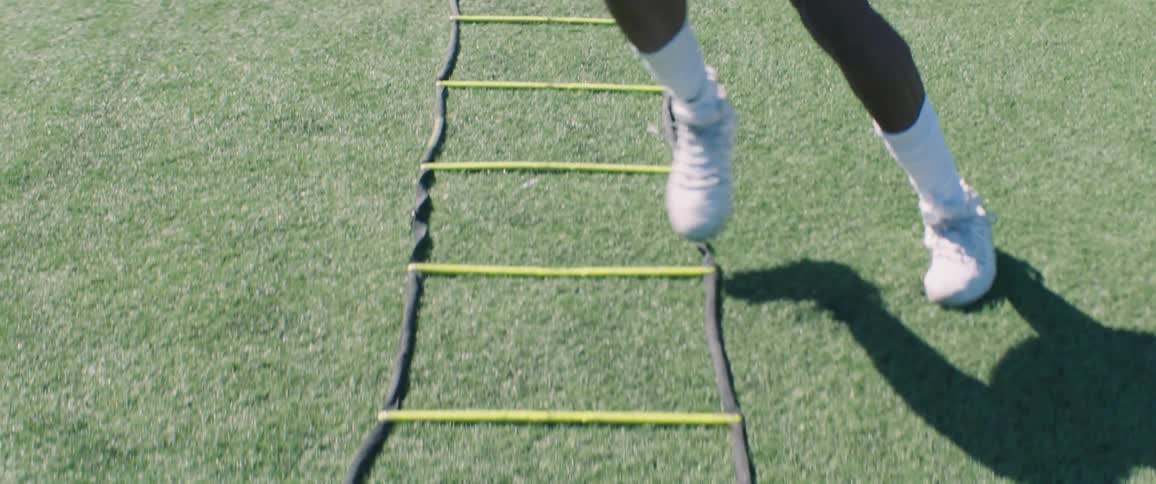 A person works out in a football field