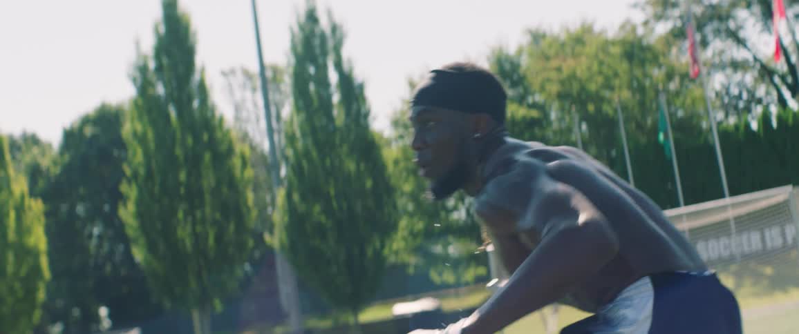A man looks around on the football field