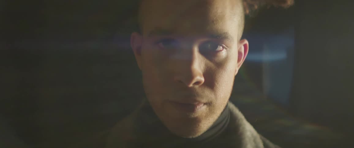 A man looks forward unblinking