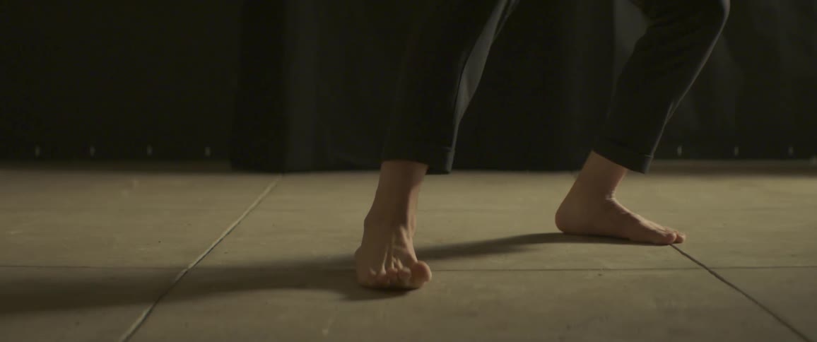 A person is dancing stepping forward