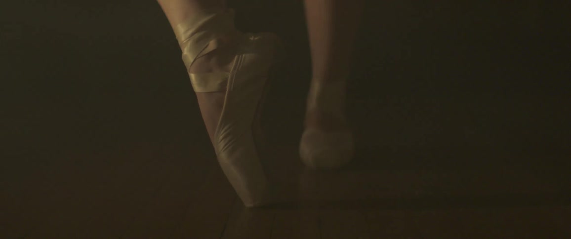 A ballerina spins on her pointe shoe