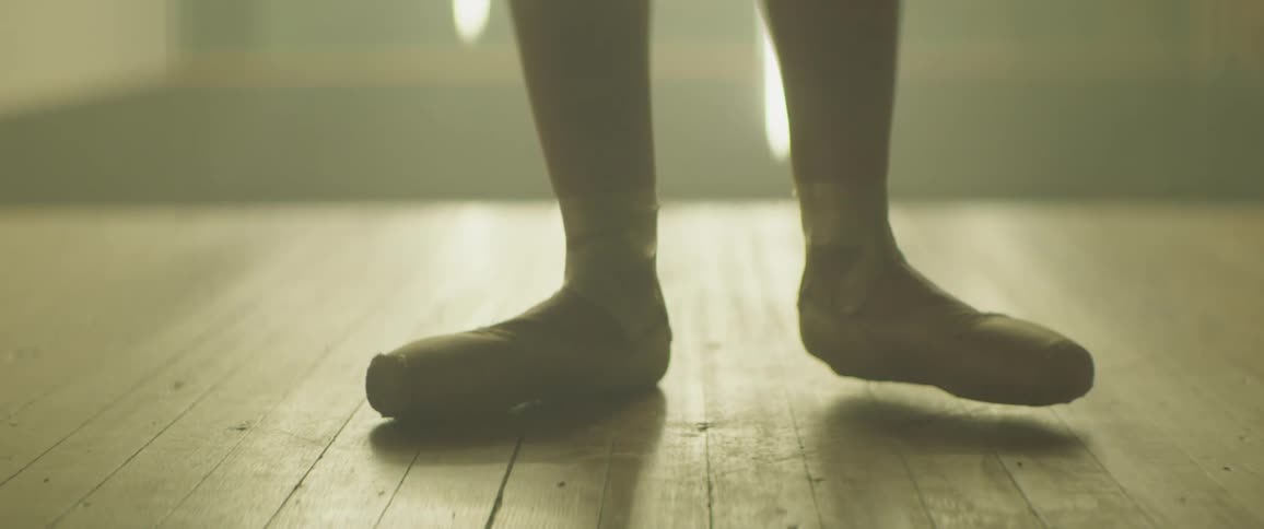 A ballerina performs a move on point and then walks away
