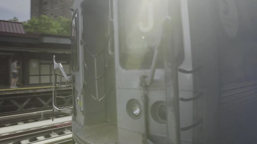 Close up of a train moving over tracks