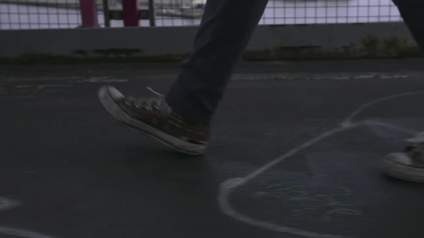 A person walks across a painted sidewalk