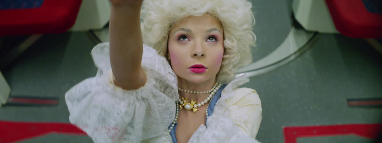 A teenage girl in a costume performing