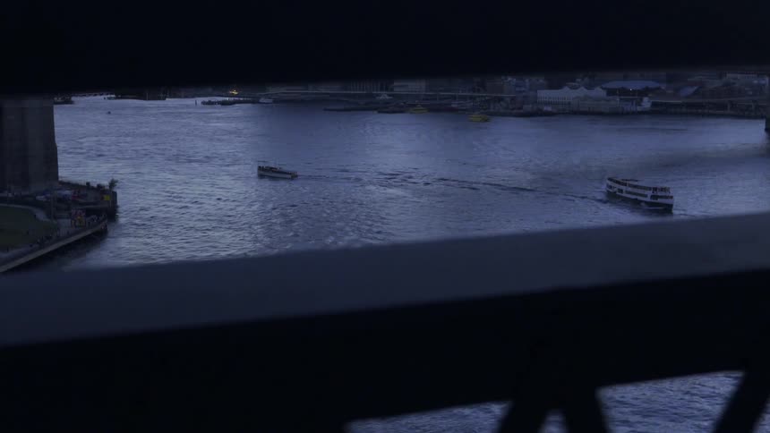 A view through two slats overlooking a river