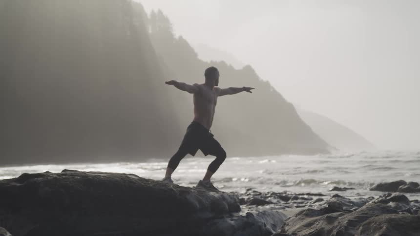 A man is stretching outdoors
