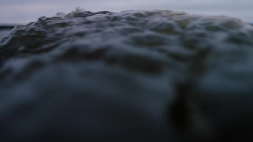 Close of of water moving around at sea level