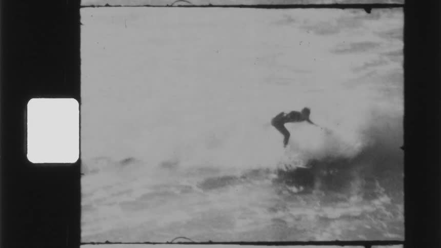 Vintage footage of man on surfboard