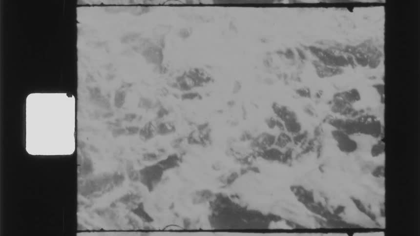 Foamy ocean waves break against the coast