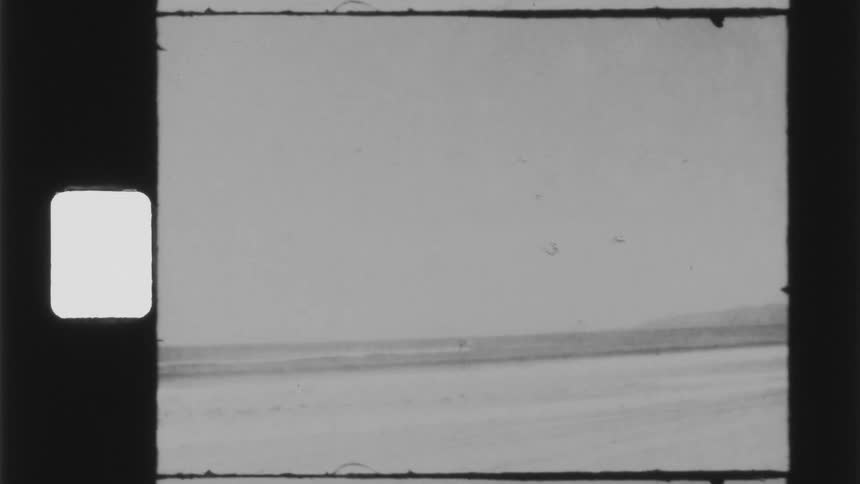 Footage of a beach is displayed in spring