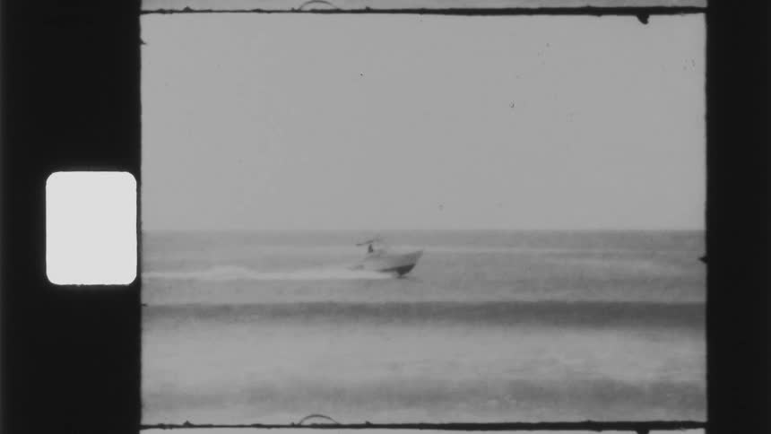 Footage of a boat driving in the ocean is displayed