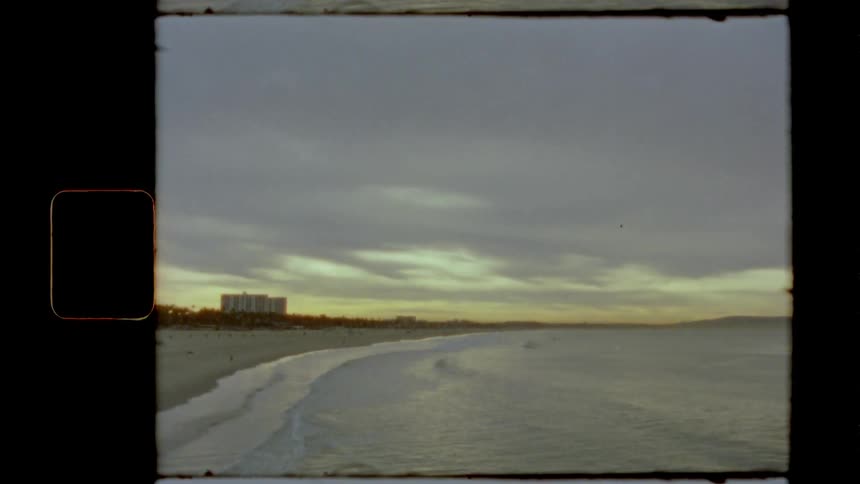Footage of a beach at dusk is displayed