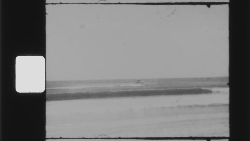 Black and white footage of a boat on the ocean