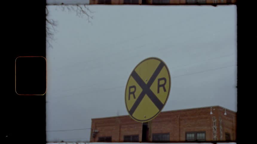 A sign in front of a railway station
