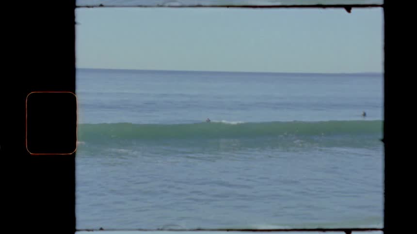 Vintage film of person surfing in ocean