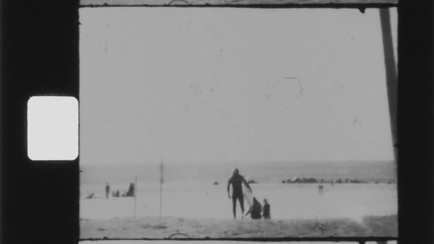 Vintage footage of people walking riding a bike and surfing at a beach