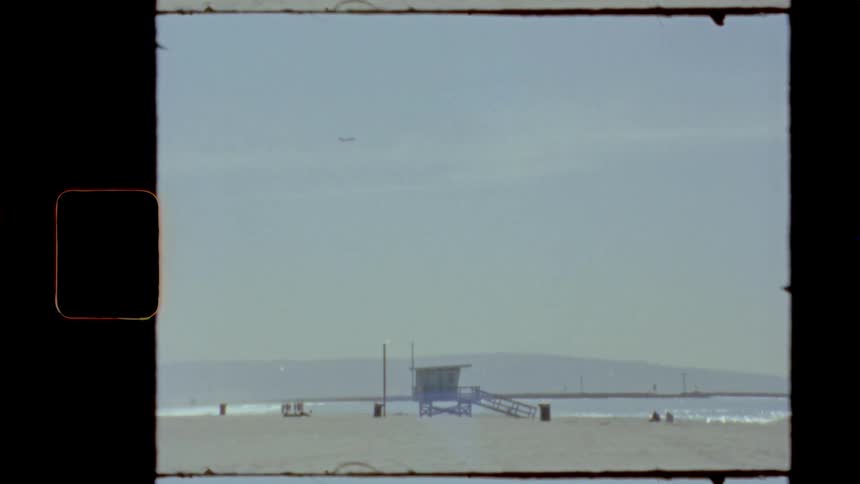 Footage of a beach is displayed in spring