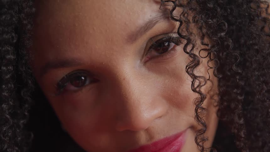 A woman is smiling indoors