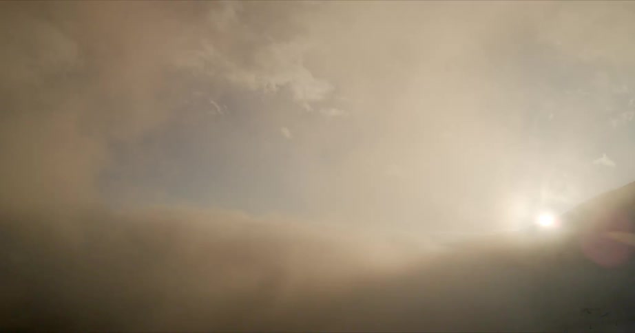 The sky with clouds and the sun