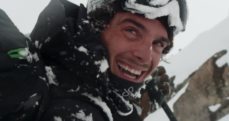 A skier laughing out in the snow