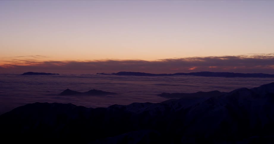 The sun is setting in the horizon of an arctic area