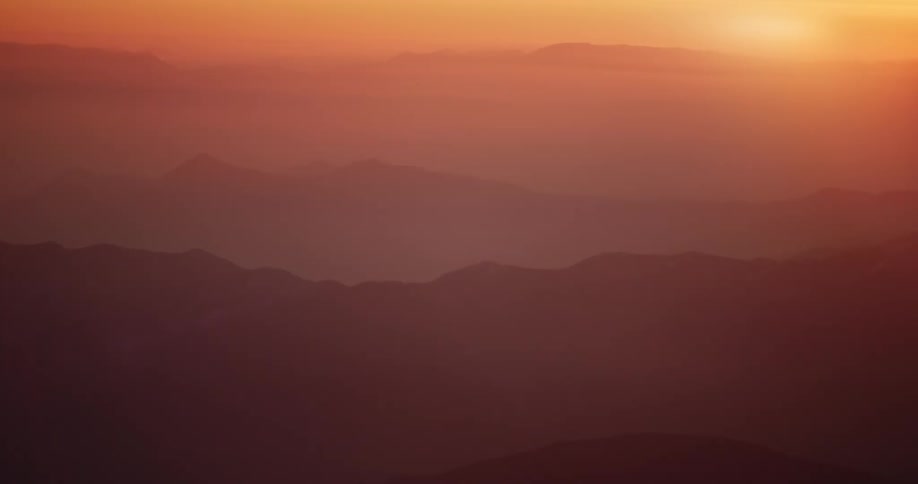 Layers of mountain ranges at sunrise