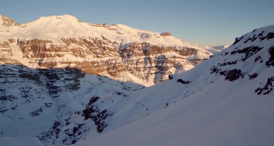 An aerial view of a mountain at dusk