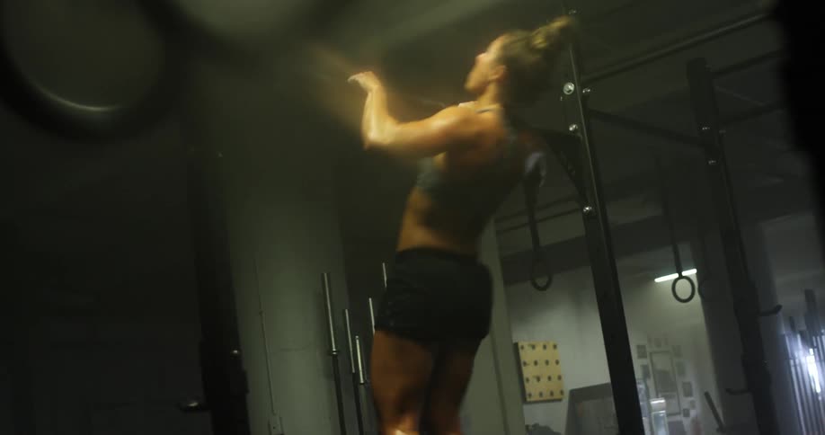 A woman is working out in a gym