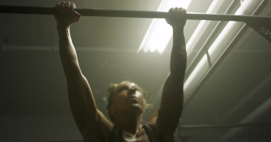 A woman is exercising in a gym