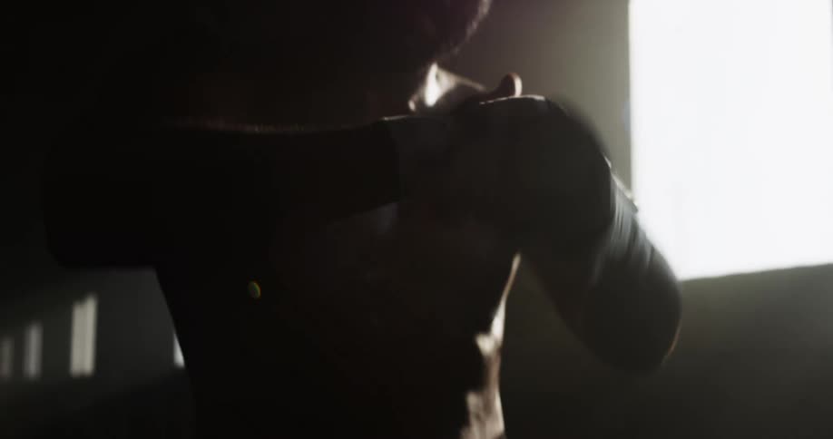 A man is taping up his fists