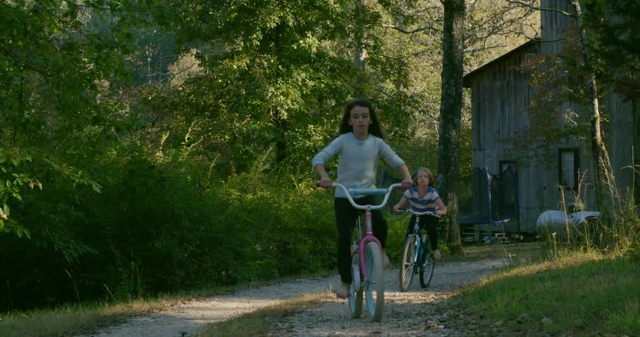 Children ride their bikes on the trail