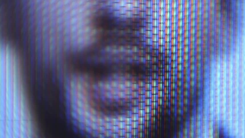 A man is speaking on the television