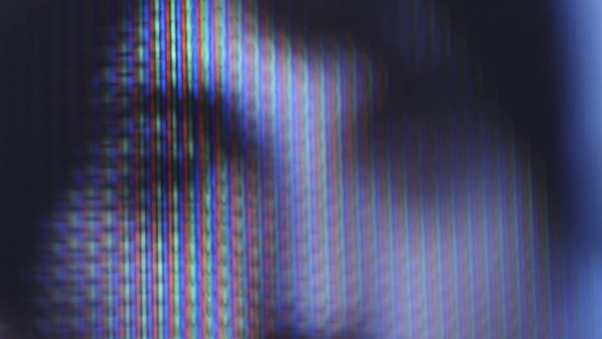 The upper half of a brown haired mans face is pixelated on a screen