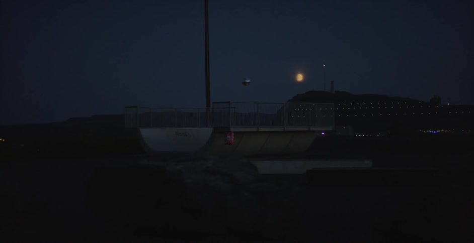A small globe can be seen floating in the distance at night