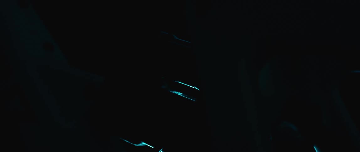 A light flashes on and off indoors to reveal an up close view of a bicycle