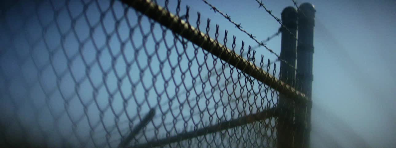 Close up of a barb wire fence