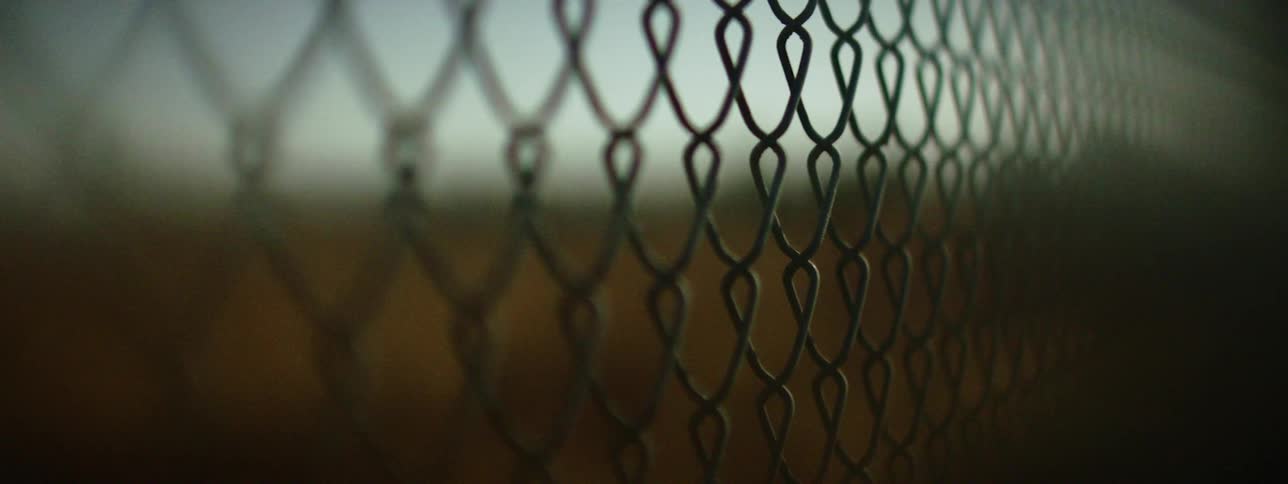 Close up of wire fence with softfocus