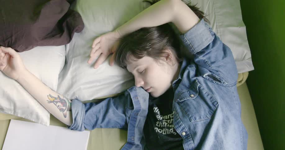 A woman is sleeping in a bed