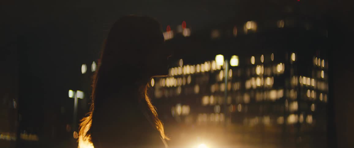 A woman standing in downtown area