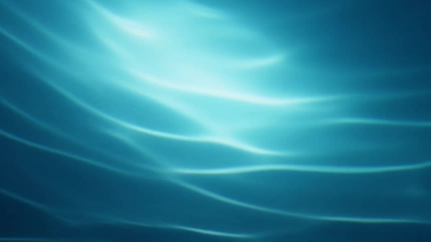 Turquoise ocean water becomes brighter closer to the surface