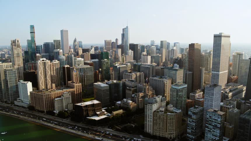 Aerial view of boats on the water in front of Chicago skyline