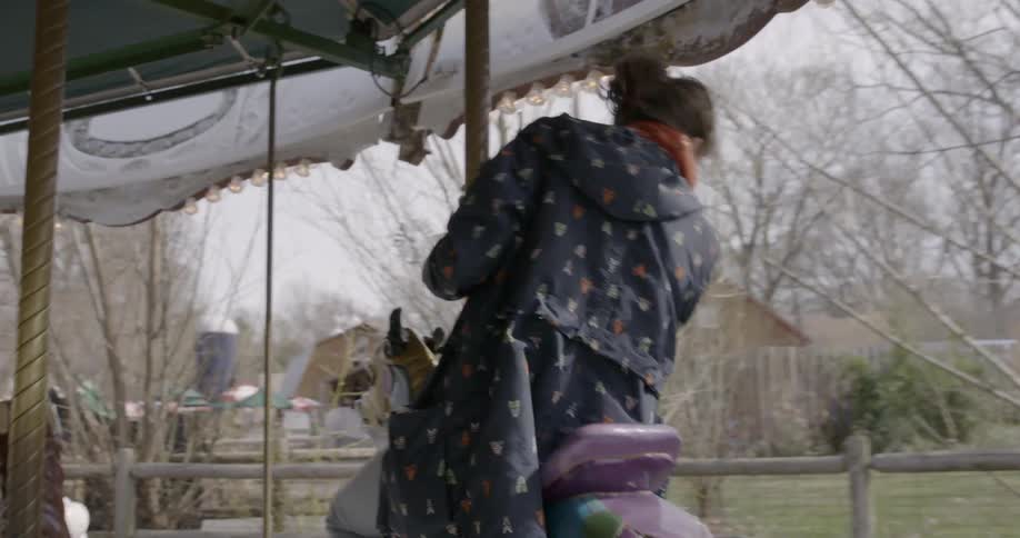 Woman riding a merry-go-round
