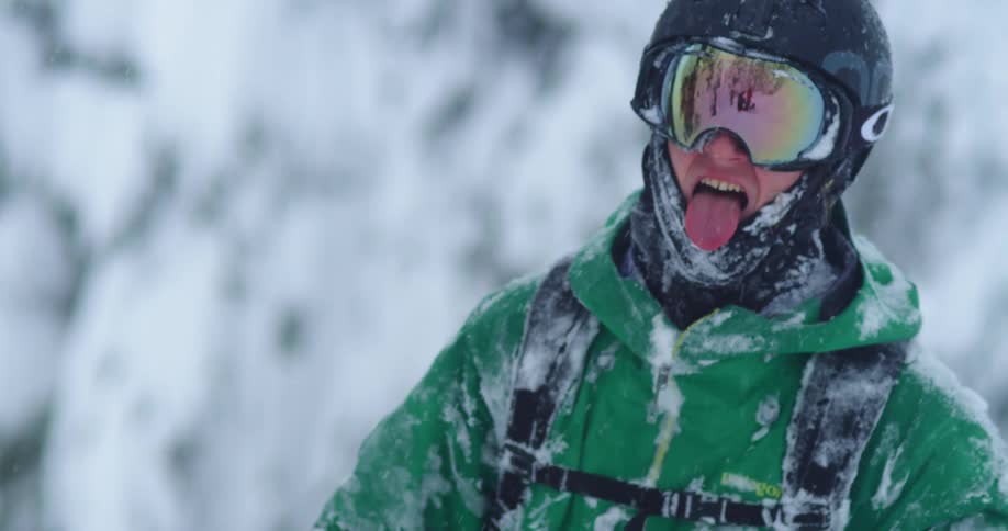 A skier catches snowflakes with his tongue