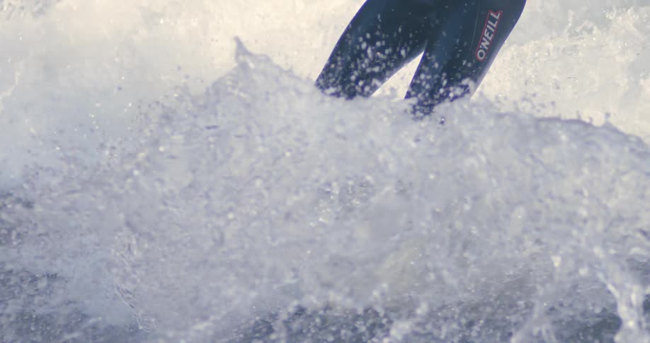 A surfer surfing on waves in the ocean